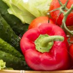 cucumbers, tomatoes, peppers, lettuce in basket